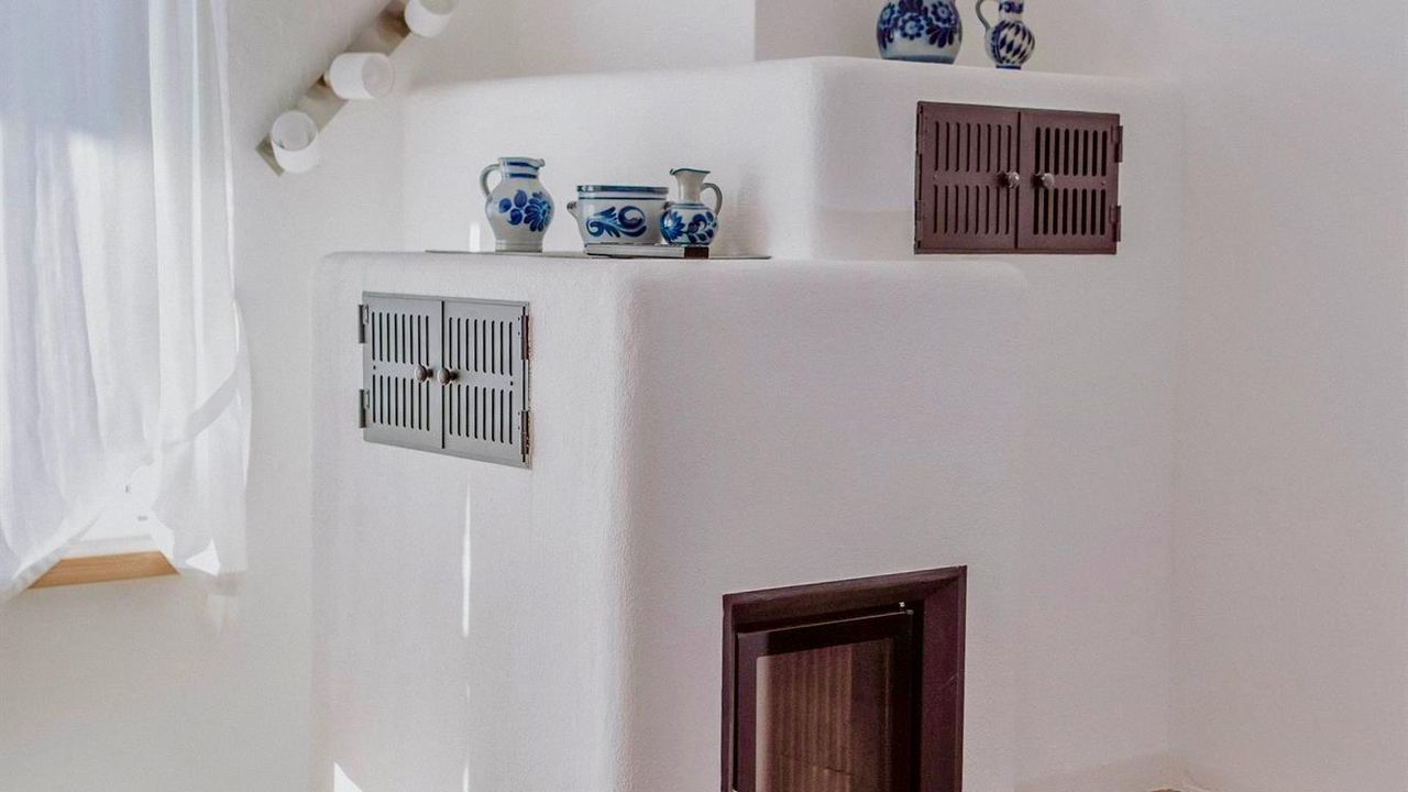 Appartement A - Wohnzimmer mit Kamin Appartement A - Wohnzimmer mit Kamin